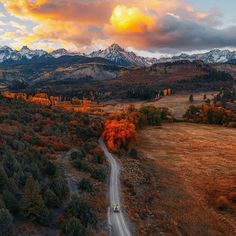 an aerial view of a road in the mountains