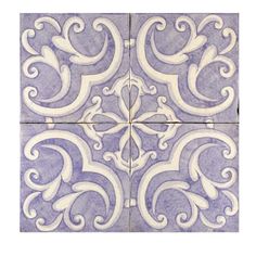 a blue and white tile with swirls on it