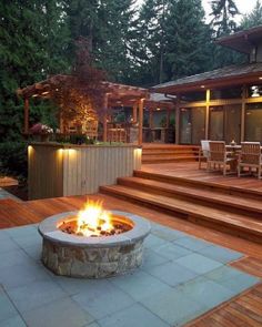 a fire pit sitting on top of a wooden deck