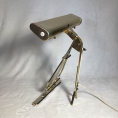 a lamp that is on top of a tripod