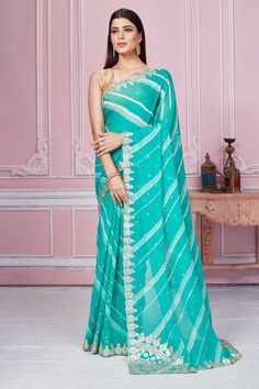 Shop sea green georgette saree online in USA with embroidered scalloped border. Look your best on festive occasions in latest designer sarees, pure silk sarees, Kanjivaram silk saris, handwoven saris, tussar silk saris, embroidered saris from Pure Elegance Indian clothing store in USA.-full view Green Embroidered Border Saree For Reception, Green Pre-draped Saree With Embroidered Border For Wedding, Green Wedding Saree With Embroidered Border, Turquoise Resham Embroidery Saree For Wedding, Turquoise Georgette Dupatta For Wedding, Turquoise Saree With Resham Embroidery For Diwali, Turquoise Georgette Wedding Dupatta, Fitted Turquoise Saree For Diwali, Turquoise Fitted Saree With Zari Work