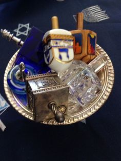 an assortment of items sitting on top of a silver plate