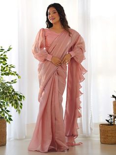 Elevate your style with this stunning peach color organza ruffle saree adorned with fancy lace border work. This ready-to-wear saree comes with a fully stitched blouse material in sizes ranging from XS to XXL, ensuring a perfect fit for any occasion. The designer saree is perfect for parties and receptions, allowing you to make a fashion statement with its trendy lace detailing. Crafted with high-quality organza material, this saree offers a luxurious feel and elegant look. Lehenga Crop Top, Lehenga Choli Wedding, Party Wear Lehenga Choli, Reception Gown, Bollywood Lehenga, Readymade Saree, Organza Sarees