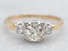 three stone diamond ring setting in yellow gold with diamonds on the band and sidestones