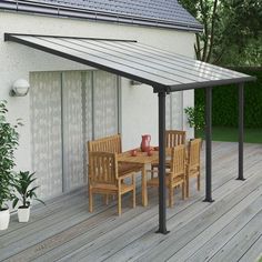 an outdoor patio with table and chairs