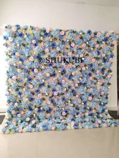 the wall is decorated with blue and pink flowers