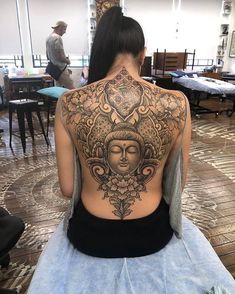 a woman with a tattoo on her back