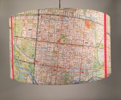 a hanging lamp with a map print on it