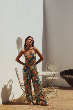 Beautiful, strapless jumpsuit with a structured top for the most flattering fit. Featuring a wide leg cut with slits on the side, this piece is perfect for your next vacation or getaway. Runs true to size 100% poly Strapless Jumpsuits And Rompers For Vacation, Chic Wide-leg Beach Jumpsuits And Rompers, Chic Wide Leg Beach Jumpsuits And Rompers, Chic Wide Leg Jumpsuits And Rompers For Beach, Chic Wide-leg Jumpsuits And Rompers For The Beach, Spring Vacation Bandeau Strapless Jumpsuit, Chic Bandeau Jumpsuits And Rompers For Beach, Spring Vacation Strapless Bandeau Jumpsuit, Summer Bandeau Jumpsuits And Rompers For A Day Out