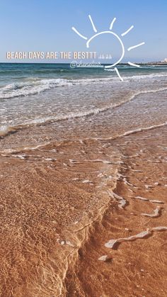 the beach has waves coming in to shore and an image of a sun above it