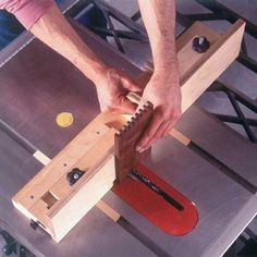 a man is working on a piece of wood with a planer and vise