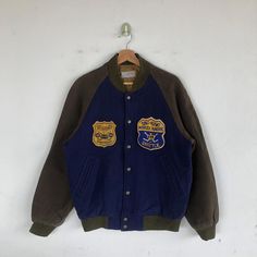 Vintage Good Old Days Varsity Jackets Seattle Hockey Wool Jacket - BS60045. Manual Measurement (laying in flat area): 1) Chest: 21.5 inch. 2) Length: 26.5 inch. 3) Shoulder: 17.5 inch. 4) Sleeve: 23.5 inch. Fabric Material: 100% Wool. Condition: In good vintage condition overall. Please check all the measurement to ensure a proper fit. Remember to allow yourself some extra room for movement. You can compare these information with your favourite jacket too. BS60045. We do combining shipping. Plea Blue Winter Outerwear With Embroidered Patch, Blue Embroidered Winter Outerwear, Retro Outerwear With Embroidered Patch And Long Sleeves, Retro Long Sleeve Outerwear With Embroidered Patch, Retro Outerwear With Embroidered Patch For Streetwear, Retro Outerwear With Embroidered Logo For Streetwear, Retro Streetwear Outerwear With Embroidered Logo, Outdoor Long Sleeve Outerwear With Embroidered Logo, Long Sleeve Outerwear With Embroidered Logo For Outdoor