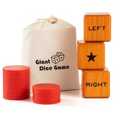 the dice game is set up next to some red plastic discs