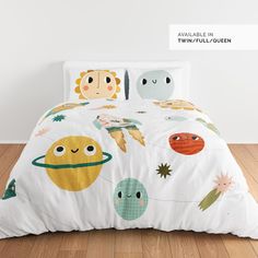 an image of a child's bed with space themed comforters