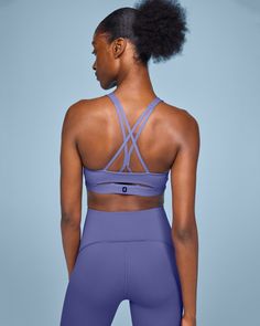 Made for low-impact workouts, flow into every movement with this buttery-soft, lightly padded sports bra Stay dry and comfortable - Made with moisture-wicking materials and a strappy open back for increased ventilation. The power mesh liner also keeps sweat out, so you can focus on your movement. Freedom of motion - Move freely, thanks to the open back design and gentle elastic underband. So you can bend and breathe in any direction. Ultimate softness - It's so lightweight, it's off your mind. U Breathable Sports Bra For Workout, Breathable Recycled Polyester Sports Bra For Workout, Versatile Medium Support Sports Bra With Go-dry, Versatile Medium Support Go-dry Sports Bra, Moisture-wicking Purple Sports Bra For Pilates, Purple Moisture-wicking Sports Bra For Pilates, Micro-elastic Recycled Polyester Sports Bra For Pilates, Breathable Recycled Polyester Sports Bra For Light Exercise, Purple Compressive Moisture-wicking Sports Bra