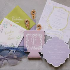 the wedding stationery is laid out on the table