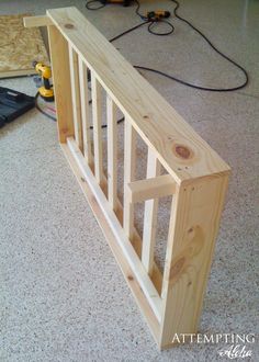 an unfinished stair rail is sitting on the floor