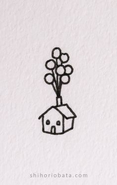 a black and white drawing of a house with flowers in the air on top of it