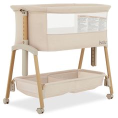 a baby crib with two drawers and a changing table on it's legs