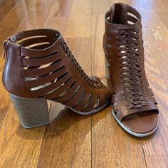 Braided Brown Faux Leather With Straps And Cut Outs Create The Breezy Top. Azip-Up Back And 3 1/2 Inch Stacked Heel. New In Box Brown Open Heel Sandals For Fall, Summer Leather Heels With Zipper Closure, Brown Faux Leather Open Toe Sandals, Spring Synthetic Heels With Zipper Closure, Spring Ankle Strap Sandals With Zipper, Faux Leather Block Heel Sandals For Fall, Leather Open Toe Sandals With Zipper, Leather Open Toe Sandals With Zipper Closure, Fall Faux Leather Sandals With Block Heel