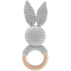 a crocheted bunny ring rattler on a white background with a wooden handle