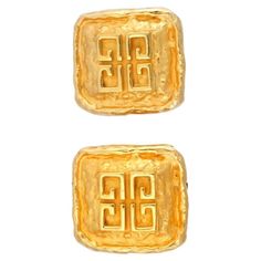 A vintage gold-tone metal clip-on earrings by Givenchy. Ca. 1980s. Square shape, relief four G logo monogram. Marked Parfums Givenchy Paris on the backside. Collectible Luxury Costume Jewelry And Lapel Accessories. Dimensions: 1 1/8 x 1 1/8 in. All measurements are approximate. Condition Overall good vintage condition. Signs of wear and age. Has some stains and scuffs. Refer to photos. Parfum Givenchy, Givenchy Logo, Vintage Givenchy, G Logo, Givenchy Paris, Art Deco Earrings, Vintage Clip, Vintage Jewels, Yellow Gold Earring