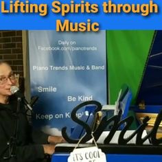 a man standing in front of a microphone with the words living spirits through music on it