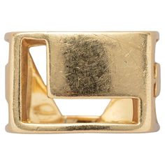 A rectangular, 18 carat yellow gold ‘Love’ band ring made of cut-out letters ‘L’, ‘O’, ‘V’ and ‘E’. Signed Tiffany, attributed to Donald Claflin for Tiffany & Co. End of 1960-1970. weight: 12.64 grams size: 18.5 mm / 7 1/2 US width: 12.5 mm / 1/2 inch Gold Love Ring, Cut Out Letters, Love Band, Tiffany And Co, Love Ring, Tiffany & Co., Band Ring, Fashion Rings, Band Rings