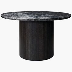 a round dining table with a black base and grey marble top, on an isolated white background