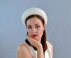 This is an elegant straw headband in ivory with pleated crinoline ribbon. The headband base is hand blocked from sinamay straw using traditional millinery techniques. I have used a beautiful rounded headband hat block to create this headpiece. I have covered the headband with pleated crinoline ribbon to give it an airy texture. The headband base is wired for extra strength and lined with velvet ribbon.This headpiece fixes with velvet ribbons that are tied at the back of the head.This is an exqui Classic White Fascinator, Elegant White Headband With Structured Crown, White Bridal Headband For Formal Occasion, Elegant White Structured Crown Headband, White Formal Bridal Headband, Formal Fitted White Headband, Cream Formal Headband Headpieces, Cream Headband For Formal Occasions, Formal Cream Headband Headpiece