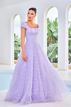 Embrace the vision of beauty and charm in this ballgown evening dress adorned with ruffled floral appliques. The gown features a square neckline, a wide waistband, and cap sleeves for a timeless appeal. The midrise v-shaped cut at the back reveals a hint of skin and is secured with a center zipper closure. The full-length skirt sculpts a ballgown silhouette, adding a touch of grandeur to your look. Big Prom Dresses Ball Gowns Blue, Jadore Dress, Floral Evening Gown, V Shape Cut, Modest Prom, Modern Princess, Prom Dresses Modest, Full Length Skirts, Evening Dresses For Weddings