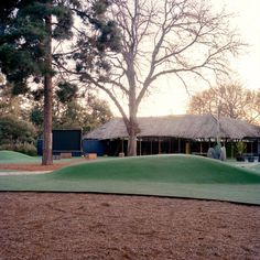 an artificial golf course in the middle of a park