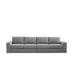 a gray couch sitting on top of a white floor