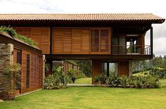 the house is made out of wood and has windows on each side that are open to let in natural light