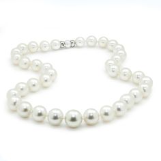 Description: This lovely 19" princess-length necklace strand has 37 round cultured South Sea pearls brought together by another pearl and an 18-karat white gold clasp. They are beautifully matched in color and luster. They graduate in size from 10mm to 14mm down to the center, and the clasp is made of 18kt white gold and a pearl for the clasp to insert into for a seamless transition. This pearl necklace strand is prominent, projecting elegance and natural beauty. These are pre-owned and in Like New condition. Specs: Material info: Solid 18Kt (750) White Gold Clasp with Pearl for InsertTotal Gram Weight: 89.9 Grams Pearl Information: 37 Round Cultured South Sea PearlsColor: White with Pink OvertonesShape: RoundLuster: Medium to HighGrade: A to AASize: 10.00mm Graduates Up to 14.00mm Marking Formal Single Strand Pearl Necklace In White Gold, Formal Single Strand White Gold Pearl Necklace, White Single Strand Pearl Necklace For Anniversary, White Pearl Necklace With Round Beads For Formal Occasions, Timeless White Pearl Necklace For Anniversary, Formal White Gold Single Strand Pearl Necklace, Single Strand Pearl Necklace In Fine Jewelry Style, Round High Luster Pearl Necklace For Anniversary, Formal White Single Strand Pearl Necklace