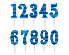 blue and white striped number candles with numbers on sticks in the shape of letters that spell out