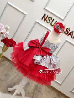 Christmas dress. Gift package. Baby girl dress. Holiday dress. Silver Sparkle Christmas dress.Elevate your little one's holiday celebrations with our enchanting Shimmering Scarlet baby dress. This delightful knee-length Christmas costume is designed to make her the star of the holiday season. With its stunning combination of bright red and shimmering silver, adorned with a large red bow on the bodice and a cascading red tulle skirt, it's the perfect choice for creating cherished holiday memories Pink Princess Christmas Dress, Princess Style Holiday Dress, Pink Princess Dress For Christmas Party, Pink Christmas Dress For Dress-up, Holiday Princess Dresses, Princess Style Christmas Party Dress, Elegant Pink Princess Dress For Festive Occasions, Princess Style Wedding Dress For Christmas, Elegant Festive Tutu Dress For Party