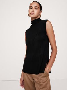 A classic ribbed sweater tank, knitted from our signature extra-fine Merino wool using a ribbed-knit stitch to enhance its cut.  Plus, we added a bit of extra length at the hem with side slits for easy layering.  Semi-fitted.  Responsible Wool Standard Certified: This global standard protects the sheep that supply the wool for this garment as well as the land they graze, working to make it better for the environment and the sheep.  Mock neck.  Straight hem with side vent detail.  Semi-fitted.  S Mock Neck Tank, The Sheep, Sweater Tank, Newborn Dresses, Knit Stitch, Work Clothes, Set Outfit, Alter Ego, Black Rib