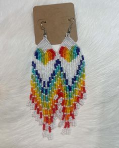 This is a beautiful pair of fringed rainbow earrings. Very lightweight, Multicolor Fringe Dangle Jewelry, Multicolor Fringe Beaded Drop Earrings, Multicolor Beaded Fringe Drop Earrings, Rainbow Fringe Dangle Jewelry, Rainbow Dangle Tassel Earrings Gift, Rainbow Fringe Earrings As Gift, Rainbow Tassel Earrings For Gifts, Rainbow Tassel Dangle Earrings, Rainbow Dangle Tassel Earrings