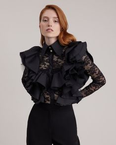 The MARGARET blouse is a quintessential piece. It is the essence of style in a coveted sheer black stretch lace, with a statement ruffle, large point collar and covered center button placket. The front and back feature a beautiful black poplin ruffle lined with tulle in a bib shape. This shirt is enhanced with two decorative gold and crystal buttons at the neck, and accompanied with French cuffs that allows for interchangeable cufflinks. Style Nr. H23F044 Black Stretch Lace, Crystal Buttons, Grad Dresses, French Women, Fall Coat, Wide Leg Denim, Independent Designers Fashion, Stretch Lace, Lace Blouse