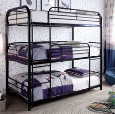 a bunk bed with two sets of mattresses on the bottom, and another set of beds below