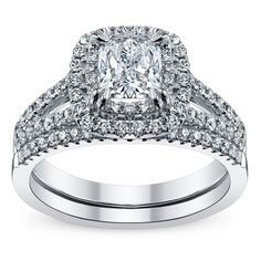 a cushion cut diamond engagement ring set with two matching bands on the band and shoulders