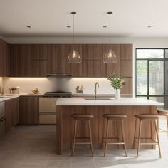 a large kitchen with wooden cabinets and stools