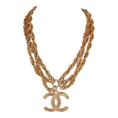 This vintage Chanel necklace is in 24K gold plated metal and has a large etched classic CC pendant with three rope chains and spring ring closure. Origin: FranceCollection: 1980sCondition: Vintage; Excellent. Minor signs of wear, including light brushing and tarnishing. Accompanied by: Chanel boxMeasurements: 16" chain, 1.75" pendant Luxury Vintage Evening Chain Necklace, Luxury Vintage Metal Chain Necklace, 1980s Necklace, Chloe 2024, Cc Necklace, Chanel Jewellery, Japan Shopping, Chanel Box, Chanel Style