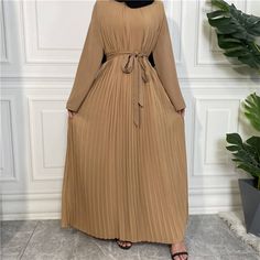 This beautiful nida pleated jumpsuit dress is the perfect outfit for any occasion. Includes with a belt, wide legged pants, long-sleeved arms, and a chiffon dress overlay. Available in 5 colours. Abaya Pants, Dress Overlay, Muslim Evening Dresses, Wide Legged Pants, Pleated Jumpsuit, Overlay Dress, Pleated Maxi, Khaki Dress, Couple Outfits