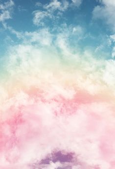 the sky is filled with pink and blue clouds as if it were painted in pastel colors