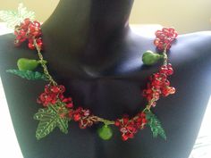 Handmade crochet necklace with seed beads and acrylic leaves linked with a silk thread. This necklace imitates red currants beauty and is garnished with little green acrylic pears. One and only necklace is waiting for that one person. * designed and made by me * sterling silver delicate clasp Unique Crochet Jewelry For Gifts, Unique Crochet Jewelry As Gift, Elegant Crochet Beaded Necklaces As Gift, Berry-colored Beaded Jewelry With Round Beads, Elegant Crochet Beaded Necklaces For Gift, Unique Crochet Jewelry As A Gift, Elegant Crochet Beaded Necklace As A Gift, Elegant Crochet Beaded Necklace For Gifts, Adjustable Crochet Beaded Necklace For Gift