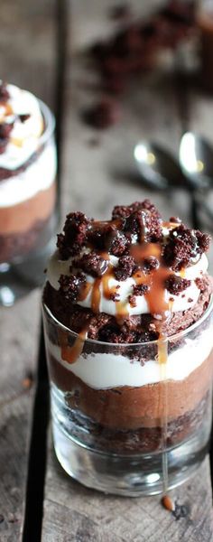 two desserts in small glass dishes on a wooden table