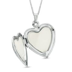 This sterling silver heart locket features mother-of-pearl accents with a polished finish. The locket's 18.0-inch box chain closes with a spring-ring clasp. Elegant Polished Locket Necklace For Valentine's Day, Classic Nickel Free Locket Necklace For Gift, Classic Nickel-free Locket Necklace As Gift, Classic Nickel-free Locket Necklace Gift, Classic Heart-shaped Nickel-free Jewelry, Sterling Silver Locket For Anniversary Gift, Silver Heart Pendant Jewelry With Hallmark, Classic Open Heart Silver Jewelry, White Gold Double Heart Locket Necklace For Gifts