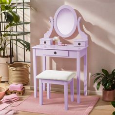 a purple vanity with mirror and stool in front of potted plant on pink rug